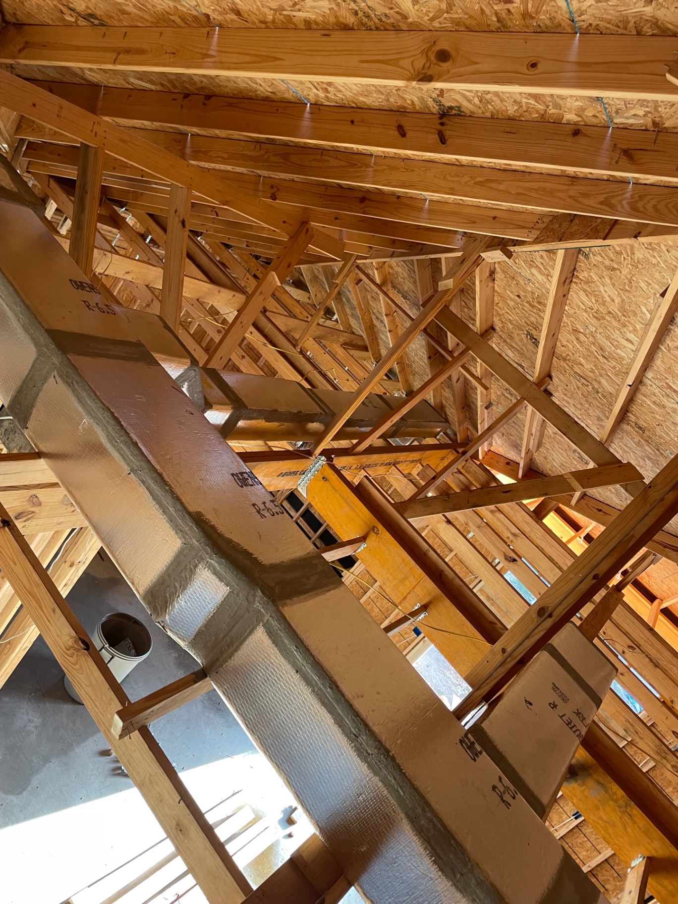 Insulated flex and rigid duct trunk lines installed in a new home attic in the Rio Grande Valley